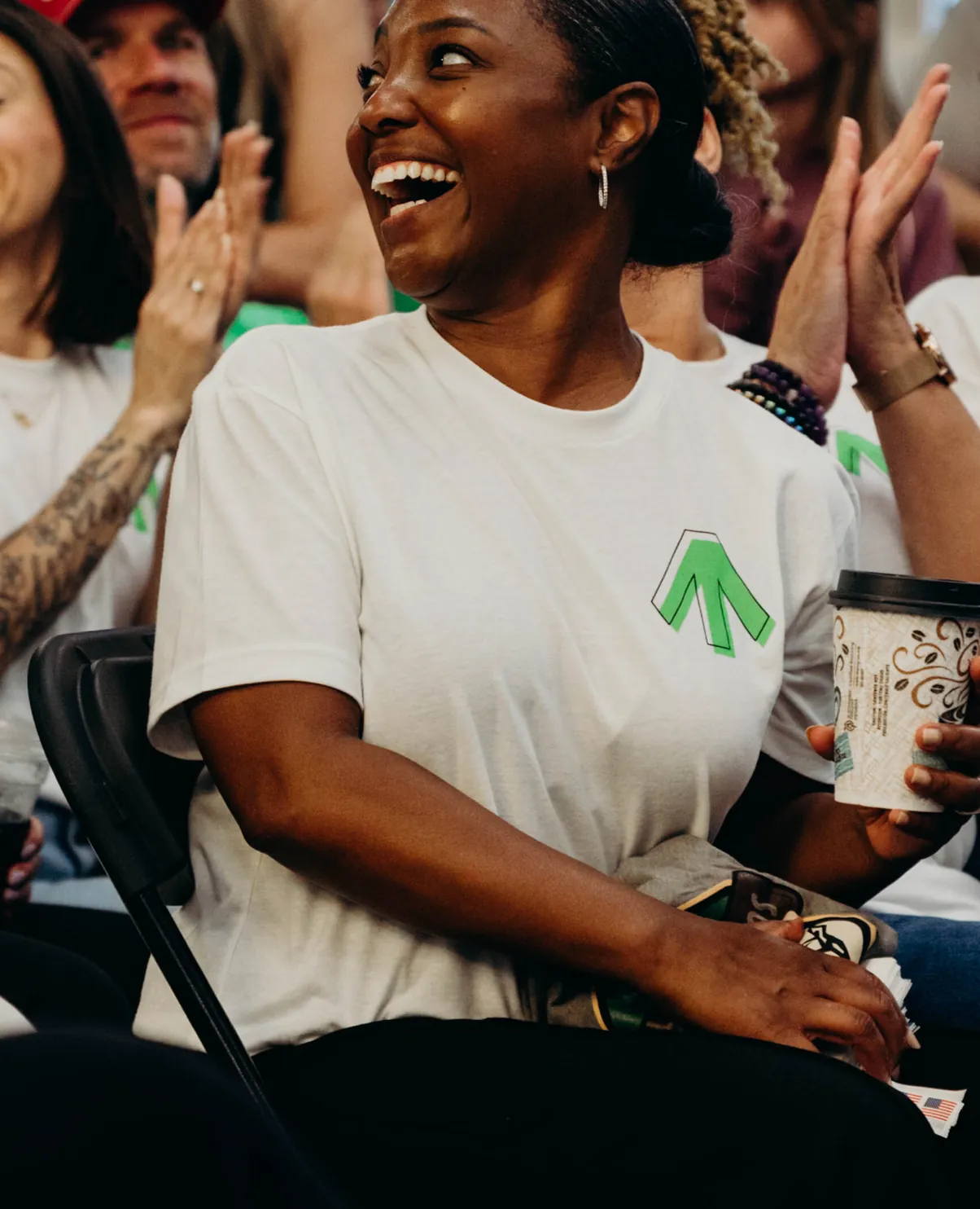 Teammates cheering at a Movement event